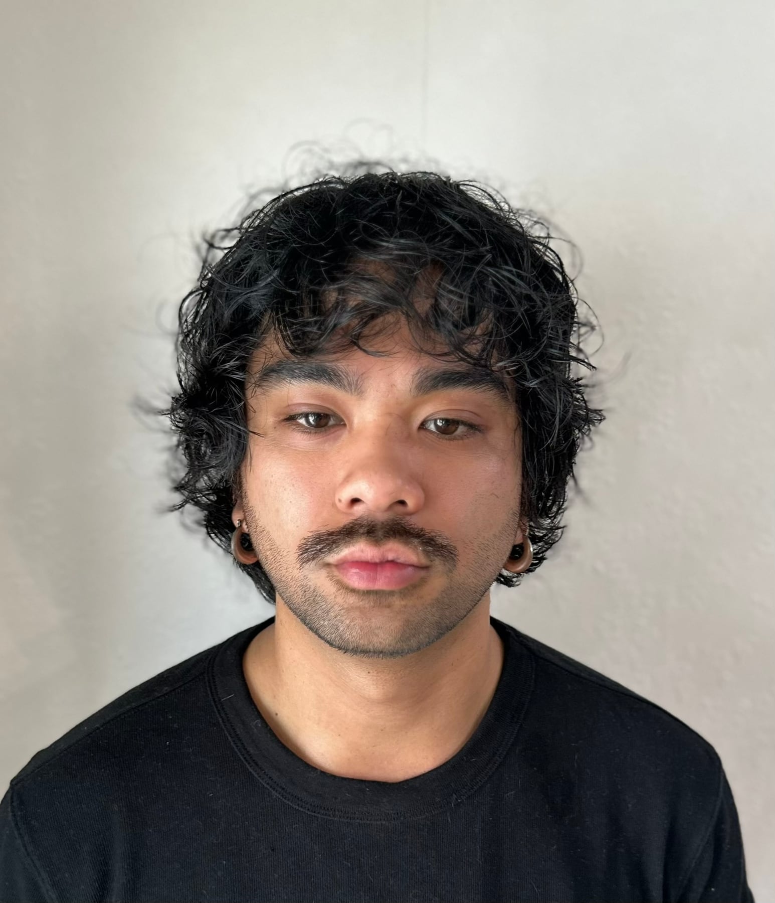Curly medium-length haircut from the front
