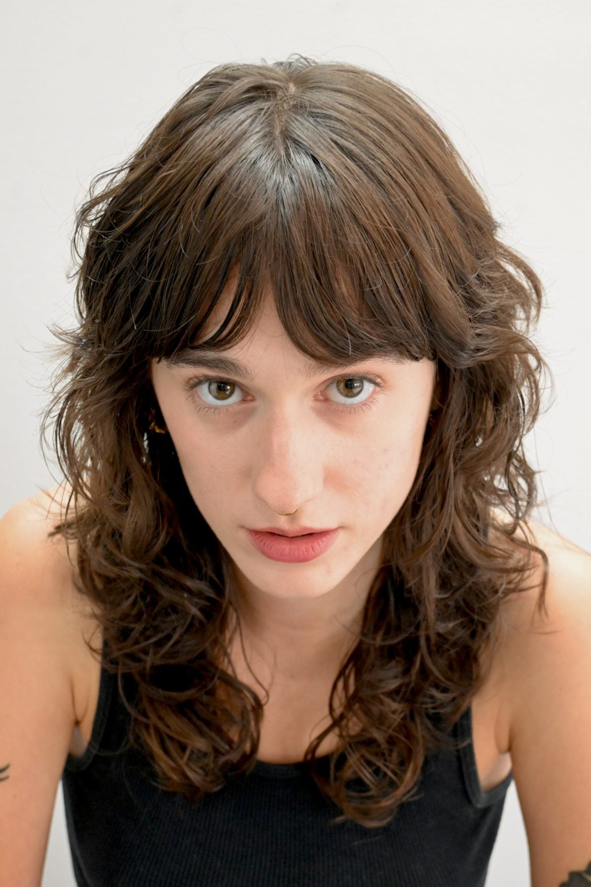 Long layered haircut with curtain fringe